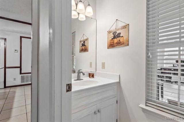 bathroom with tile patterned floors, visible vents, and vanity