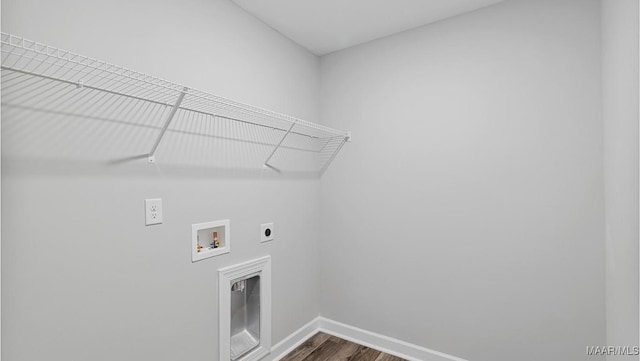 washroom featuring baseboards, hookup for a washing machine, dark wood-type flooring, laundry area, and electric dryer hookup