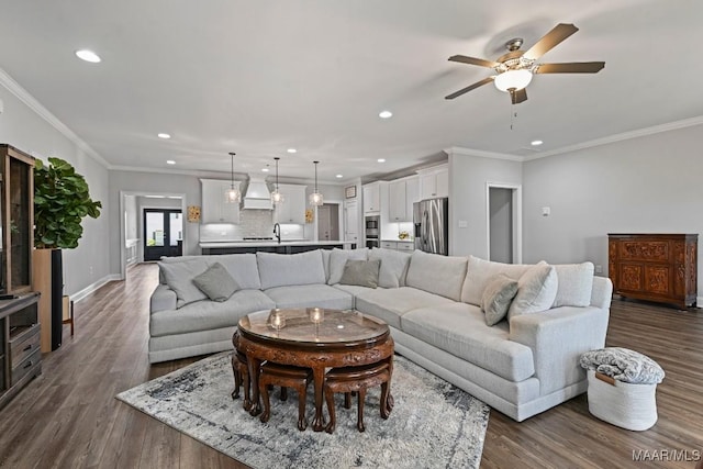 living area featuring crown molding, dark wood-style floors, ceiling fan, and recessed lighting