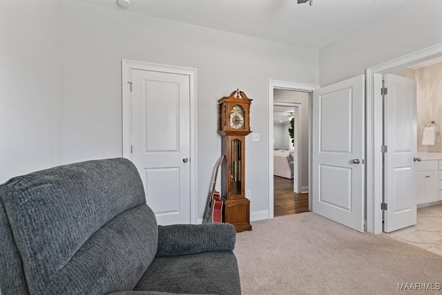 living area with ceiling fan