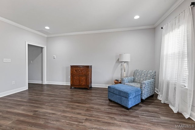 sitting room featuring crown molding, dark wood-type flooring, and recessed lighting