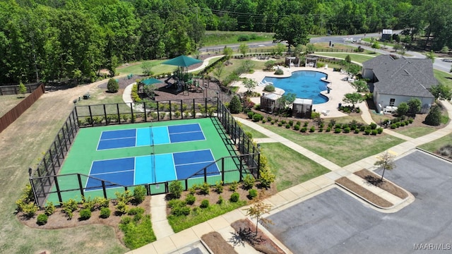 birds eye view of property with a forest view