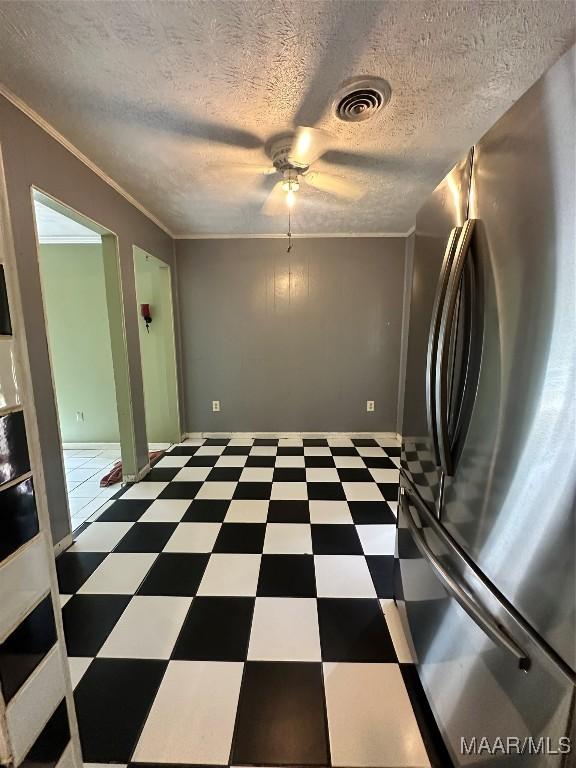 5545 E Shades Valley Dr, Montgomery, AL 36108 - interior space with ornamental molding, a textured ceiling, visible vents, tile patterned floors, and ceiling fan