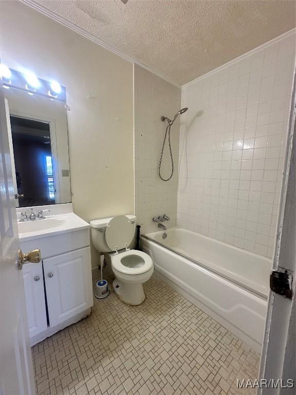 5545 E Shades Valley Dr, Montgomery, AL 36108 - full bathroom featuring toilet,  shower combination, crown molding, a textured ceiling, and vanity
