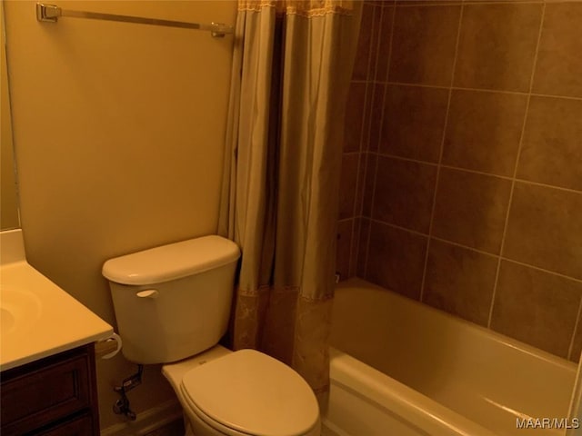 bathroom with vanity, toilet, and shower / bath combination with curtain