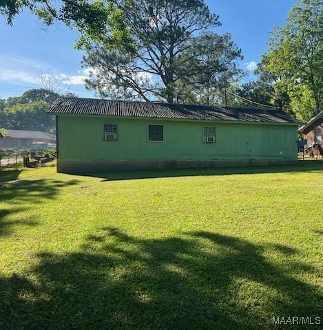 185 Conley Cir, Montgomery, AL 36110 - back of house with a lawn and metal roof