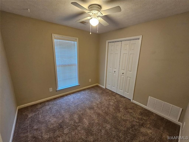 1946 Regent Rd, Prattville, AL 36066 - unfurnished bedroom with a closet, carpet floors, a textured ceiling, visible vents, and baseboards