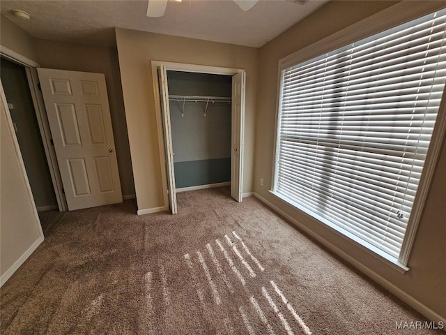 1946 Regent Rd, Prattville, AL 36066 - unfurnished bedroom featuring carpet flooring, a closet, baseboards, and a ceiling fan