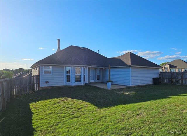 1946 Regent Rd, Prattville, AL 36066 - rear view of house featuring a fenced backyard, a patio area, and a lawn