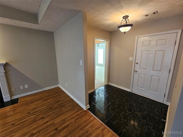 1946 Regent Rd, Prattville, AL 36066 - foyer featuring baseboards, dark wood finished floors, visible vents, and a textured ceiling