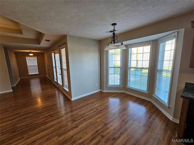1946 Regent Rd, Prattville, AL 36066 - unfurnished dining area featuring baseboards, a healthy amount of sunlight, and dark wood finished floors