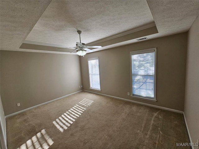 1946 Regent Rd, Prattville, AL 36066 - carpeted empty room with baseboards, a tray ceiling, and a textured ceiling