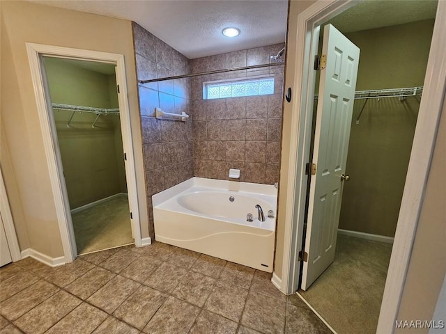 1946 Regent Rd, Prattville, AL 36066 - full bath with tile patterned flooring, a textured ceiling, shower / bathtub combination, and baseboards
