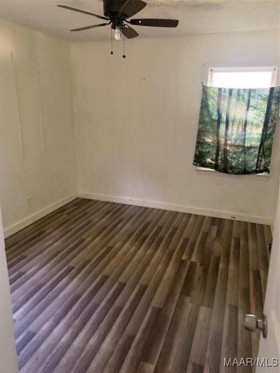 341 Chisholm St, Montgomery, AL 36110 - empty room featuring ceiling fan, baseboards, and dark wood-style floors