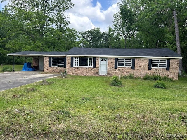 167 County Road 162nd Rd, Orrville, AL 36767 - ranch-style home with an attached carport, driveway, a front lawn, and brick siding