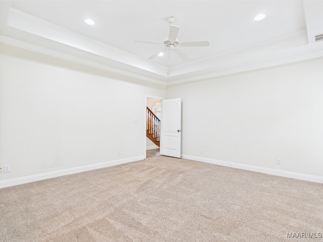 175 Rosemere Dr, Tallassee, AL 36078 - spare room with a tray ceiling, ornamental molding, light carpet, recessed lighting, and ceiling fan