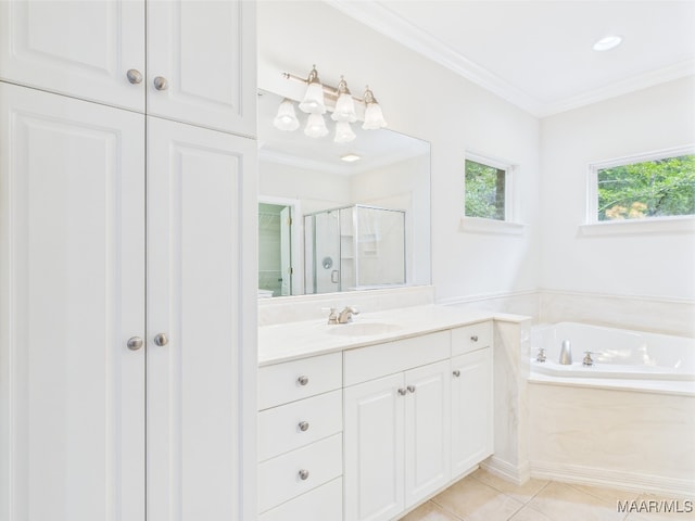 175 Rosemere Dr, Tallassee, AL 36078 - bathroom featuring a shower stall, vanity, ornamental molding, a garden tub, and tile patterned floors