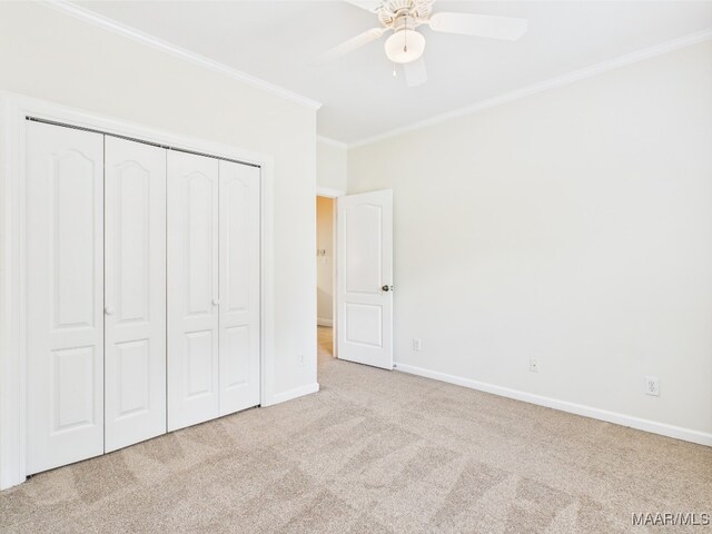 175 Rosemere Dr, Tallassee, AL 36078 - unfurnished bedroom with carpet flooring, ornamental molding, baseboards, a closet, and a ceiling fan