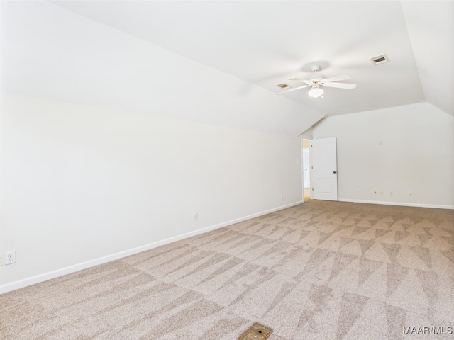 175 Rosemere Dr, Tallassee, AL 36078 - carpeted spare room featuring vaulted ceiling, ceiling fan, and baseboards