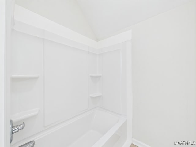 175 Rosemere Dr, Tallassee, AL 36078 - bathroom with vaulted ceiling, shower / washtub combination, and baseboards