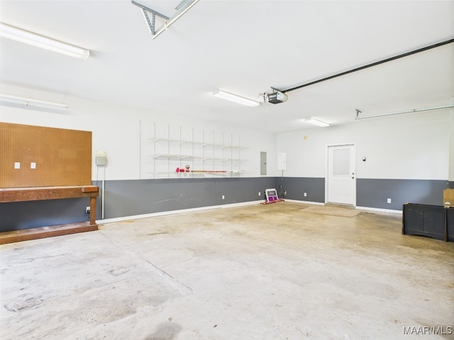 175 Rosemere Dr, Tallassee, AL 36078 - garage featuring a workshop area and a garage door opener