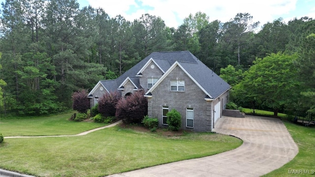 175 Rosemere Dr, Tallassee, AL 36078 - view of side of property with driveway, a yard, brick siding, and roof with shingles