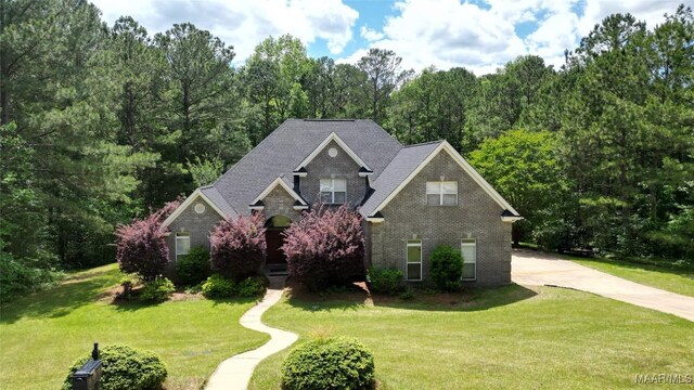 175 Rosemere Dr, Tallassee, AL 36078 - traditional-style home featuring brick siding, a front yard, and driveway