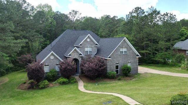 175 Rosemere Dr, Tallassee, AL 36078 - traditional-style home featuring brick siding, a front yard, and concrete driveway