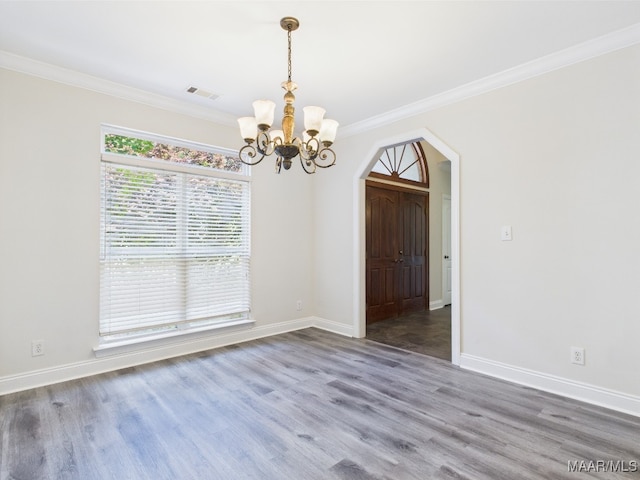 175 Rosemere Dr, Tallassee, AL 36078 - unfurnished dining area with arched walkways, a chandelier, wood finished floors, crown molding, and baseboards