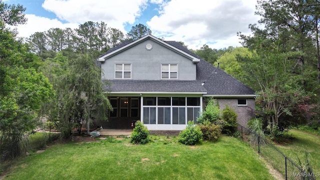 175 Rosemere Dr, Tallassee, AL 36078 - rear view of house with roof with shingles, a sunroom, and a patio