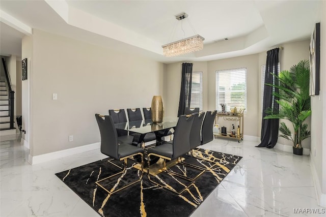 211 Oakwood Dr, Hope Hull, AL 36043 - dining area featuring a raised ceiling, marble tiled floors, baseboards, and stairway