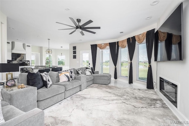 211 Oakwood Dr, Hope Hull, AL 36043 - living room with a glass covered fireplace, ceiling fan, marble finish flooring, and recessed lighting