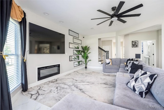 211 Oakwood Dr, Hope Hull, AL 36043 - living room with ceiling fan, plenty of natural light, a glass covered fireplace, stairway, and recessed lighting