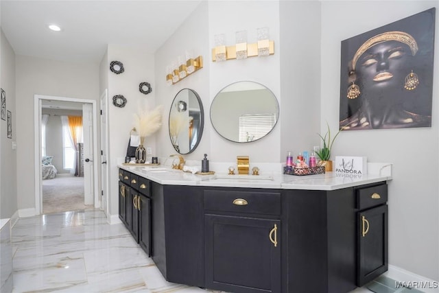 211 Oakwood Dr, Hope Hull, AL 36043 - bathroom with marble tiled floors, baseboards, and vanity