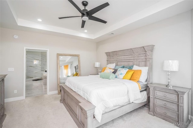 211 Oakwood Dr, Hope Hull, AL 36043 - bedroom with light carpet, a raised ceiling, recessed lighting, ensuite bath, and baseboards