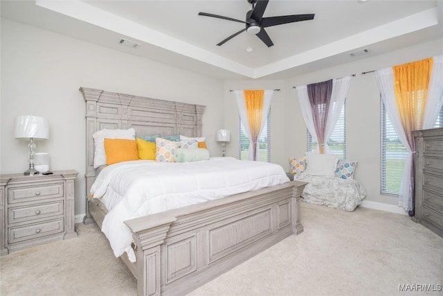 211 Oakwood Dr, Hope Hull, AL 36043 - bedroom with light colored carpet, a raised ceiling, and multiple windows