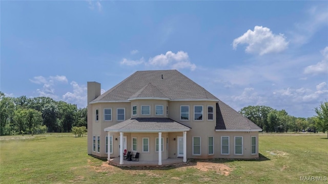 211 Oakwood Dr, Hope Hull, AL 36043 - rear view of property with a chimney, stucco siding, a lawn, a patio, and a shingled roof