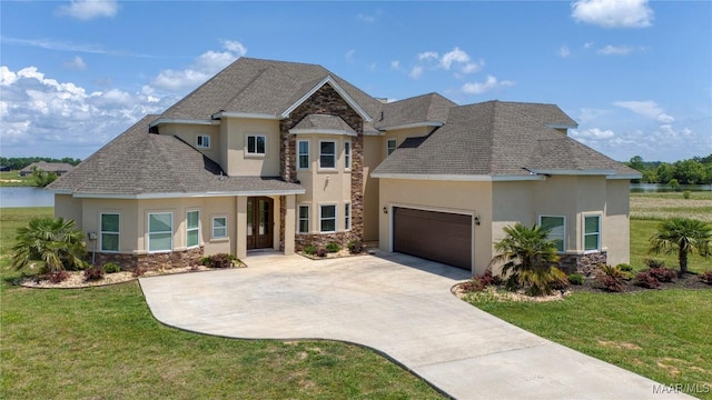 211 Oakwood Dr, Hope Hull, AL 36043 - view of front of property with stucco siding, stone siding, driveway, and a garage