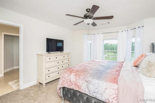 211 Oakwood Dr, Hope Hull, AL 36043 - bedroom with baseboards, a ceiling fan, and light colored carpet