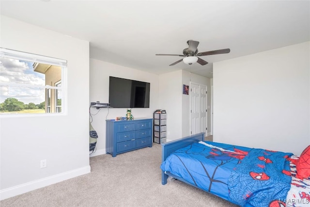 211 Oakwood Dr, Hope Hull, AL 36043 - bedroom featuring light carpet, baseboards, and a ceiling fan