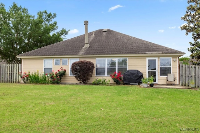 back of property featuring roof with shingles