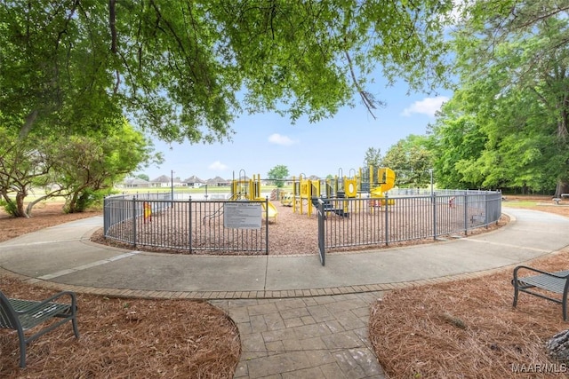 view of property's community featuring fence