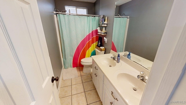 full bath featuring tile patterned floors, toilet, a shower with shower curtain, and double vanity