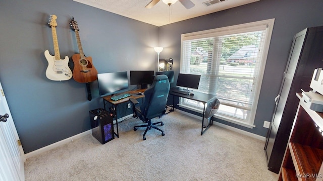 home office featuring a ceiling fan, baseboards, and carpet floors