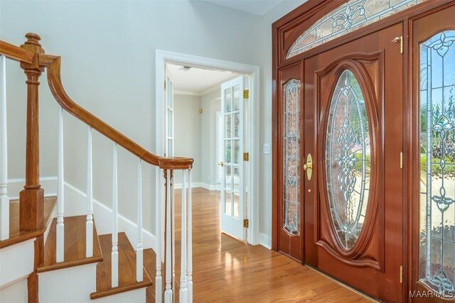 8180 Longneedle Pl, Montgomery, AL 36117 - foyer featuring stairway, crown molding, wood finished floors, and baseboards