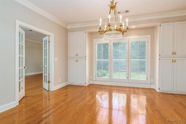 8180 Longneedle Pl, Montgomery, AL 36117 - unfurnished dining area featuring light wood-style floors, a chandelier, crown molding, french doors, and baseboards