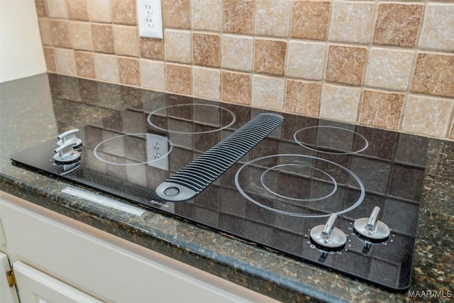 8180 Longneedle Pl, Montgomery, AL 36117 - kitchen view of tasteful backsplash and black electric stovetop