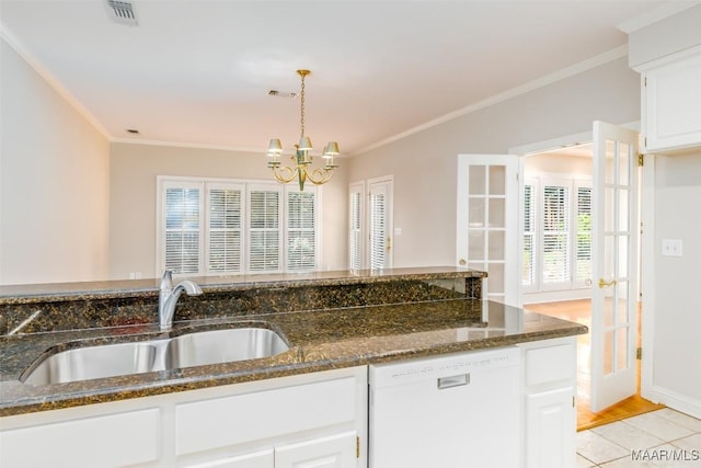 8180 Longneedle Pl, Montgomery, AL 36117 - kitchen featuring white dishwasher, a sink, crown molding, a chandelier, and dark stone counters