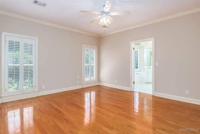 8180 Longneedle Pl, Montgomery, AL 36117 - unfurnished room with plenty of natural light, wood finished floors, a ceiling fan, crown molding, and baseboards