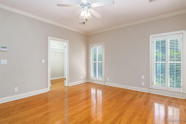 8180 Longneedle Pl, Montgomery, AL 36117 - unfurnished room featuring plenty of natural light, light wood-style flooring, a ceiling fan, baseboards, and crown molding